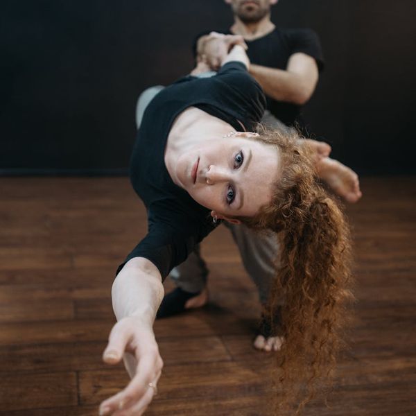 Athletic man in a dynamic pose symbolizing strength and energy.